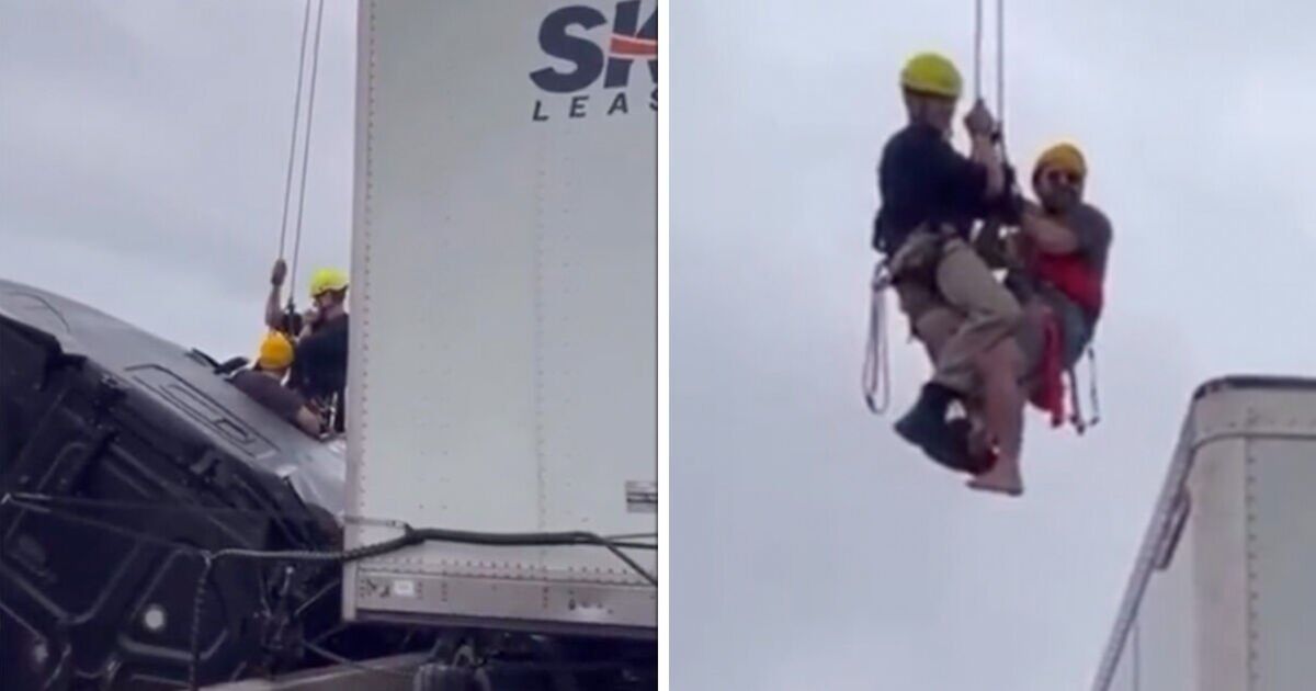 Dramatic moment firefighter rescues trapped driver from truck dangling over bridge
