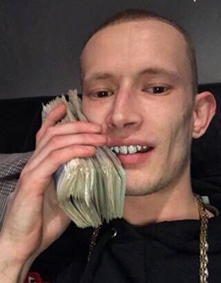 Drug kingpin who posed with &#039;diamond teeth&#039; and wads of cash jailed